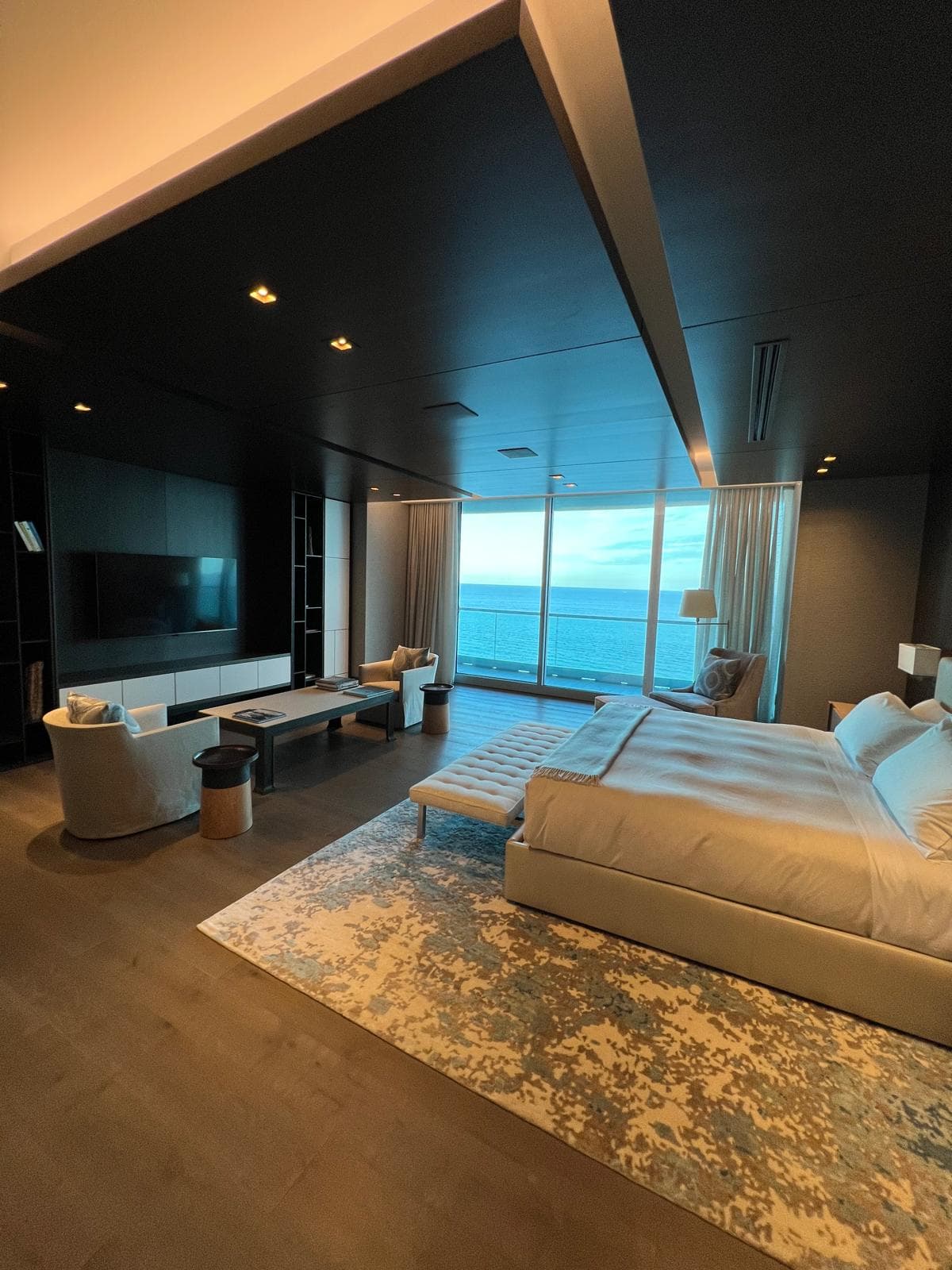 Dark bedroom with ocean view